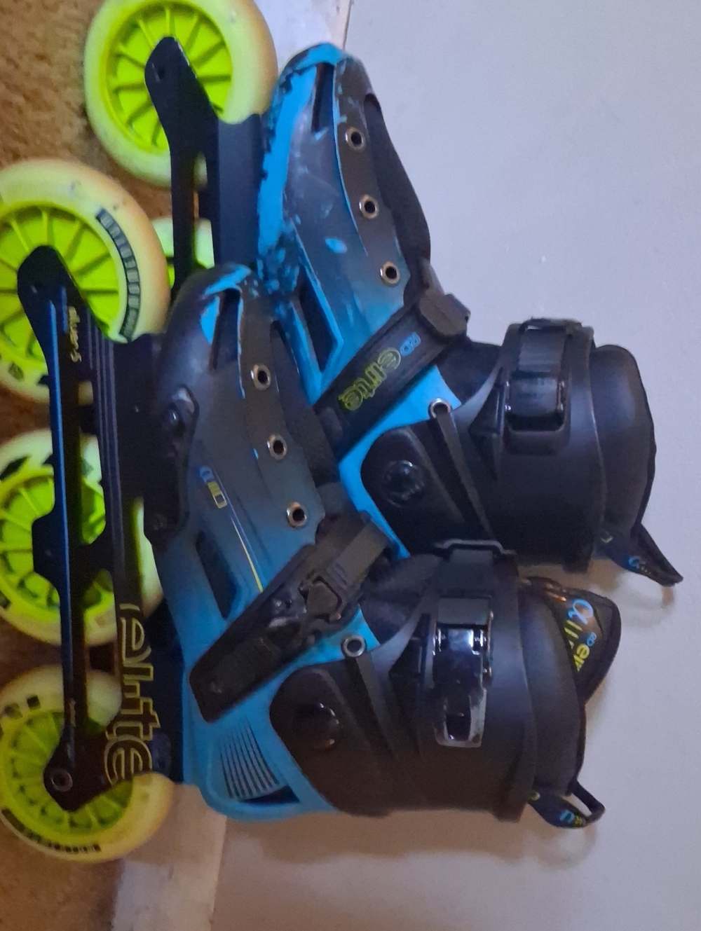 Adjustable Blue and Black Inline Skates with Neon Yellow Wheels